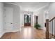 Elegant foyer featuring hardwood floors, staircase, stylish lighting, and grand entrance at 4445 Pebble Rock Dr, Cumming, GA 30041