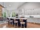 Spacious kitchen with a large island, modern appliances, and an adjacent dining area at 4445 Pebble Rock Dr, Cumming, GA 30041