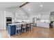 Bright kitchen featuring a large island, stainless steel appliances, and stylish white cabinetry at 4445 Pebble Rock Dr, Cumming, GA 30041