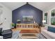 Cozy living room with a modern entertainment center, vaulted ceiling, and natural light at 4445 Pebble Rock Dr, Cumming, GA 30041