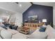 Cozy living room featuring a modern fireplace, plush seating, and stylish decor at 4445 Pebble Rock Dr, Cumming, GA 30041