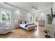Serene primary bedroom suite featuring hardwood floors, recessed lighting, and tray ceilings at 4445 Pebble Rock Dr, Cumming, GA 30041