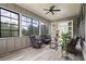 Bright sunroom with large windows offering beautiful views and comfortable seating at 4445 Pebble Rock Dr, Cumming, GA 30041