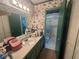 Vintage bathroom with a large mirror and vanity, offering a retro charm and a functional layout at 713 Pine Chase Ct, Lawrenceville, GA 30043