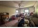 Bedroom featuring a ceiling fan and two windows bringing in natural light, awaiting personalized finishing touches and décor at 713 Pine Chase Ct, Lawrenceville, GA 30043