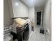 Functional laundry room featuring modern washer/dryer and ample overhead cabinet storage for organization at 713 Pine Chase Ct, Lawrenceville, GA 30043