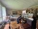A cluttered living room showcasing natural light from a window and traditional design elements at 713 Pine Chase Ct, Lawrenceville, GA 30043