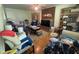 A cozy living room with a brick fireplace and built-in shelving offering storage at 713 Pine Chase Ct, Lawrenceville, GA 30043