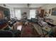 A living room is shown, filled with furniture and various items at 713 Pine Chase Ct, Lawrenceville, GA 30043