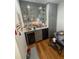 A butler's pantry features gray cabinets, glass fronts, and plenty of storage space at 713 Pine Chase Ct, Lawrenceville, GA 30043