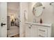 Bathroom vanity featuring marble top, white cabinets and modern fixtures; bedroom is visible through the door at 1718 Ridgewood Ne Dr, Atlanta, GA 30307