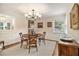 Inviting dining room with a round table, stylish chandelier, and wainscoting at 1718 Ridgewood Ne Dr, Atlanta, GA 30307