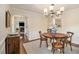 Elegant dining room featuring a round wood table, modern lighting, and classic decor at 1718 Ridgewood Ne Dr, Atlanta, GA 30307