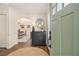 Welcoming entryway with wood floors, stylish decor, and a view into the dining area at 1718 Ridgewood Ne Dr, Atlanta, GA 30307