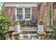 Charming front porch with rocking chairs, decorative planters, and a brick facade at 1718 Ridgewood Ne Dr, Atlanta, GA 30307