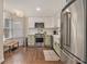 Updated kitchen with stainless steel appliances, white subway tile backsplash, and hardwood floors at 1718 Ridgewood Ne Dr, Atlanta, GA 30307