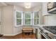 Bright kitchen nook area with a bench seat and view of the backyard at 1718 Ridgewood Ne Dr, Atlanta, GA 30307
