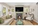 Bright living room showcases a brick fireplace, large windows, and comfortable seating at 1718 Ridgewood Ne Dr, Atlanta, GA 30307