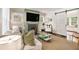 Cozy living room features a fireplace, white sofa, and a barn door at 1718 Ridgewood Ne Dr, Atlanta, GA 30307