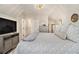 Spacious bedroom featuring a decorative chandelier, sloped ceilings, and a storage cabinet at 1718 Ridgewood Ne Dr, Atlanta, GA 30307