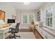 Cozy office with custom built-ins, work station, and natural light at 1718 Ridgewood Ne Dr, Atlanta, GA 30307