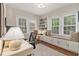 Bright office space with built-in bookshelves, window seat, and a large desk at 1718 Ridgewood Ne Dr, Atlanta, GA 30307