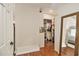 A walk-in closet with hardwood floors that offers ample storage and organization with clothing and shoes at 1718 Ridgewood Ne Dr, Atlanta, GA 30307