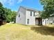 The backyard features a deck, green grass, and a side door to the basement, offering outdoor relaxation at 203 Galway Ln, Hampton, GA 30228