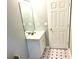 Bathroom featuring a single sink vanity and black and white floors at 203 Galway Ln, Hampton, GA 30228