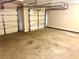 Spacious garage with two overhead doors at 203 Galway Ln, Hampton, GA 30228