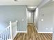 Hallway view highlighting the wood-look flooring and fresh paint at 203 Galway Ln, Hampton, GA 30228