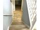 This stairway features wood-look steps and white railings at 203 Galway Ln, Hampton, GA 30228