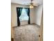 Bright bedroom with neutral carpet and curtains at 3041 Regal Dr, Mcdonough, GA 30253