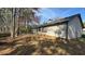 Back exterior of the property with trees and patio at 5359 Stafford Nw Dr, Lilburn, GA 30047
