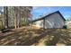 Back exterior of the property with trees and patio at 5359 Stafford Nw Dr, Lilburn, GA 30047
