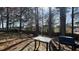 Backyard with trees, patio, grill, and dining table at 5359 Stafford Nw Dr, Lilburn, GA 30047