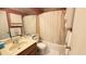 Standard bathroom with vanity, toilet, and shower-tub combination at 5359 Stafford Nw Dr, Lilburn, GA 30047