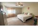 Inviting bedroom with neutral walls, carpet, and natural light at 5359 Stafford Nw Dr, Lilburn, GA 30047