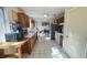 Functional kitchen with tile floors, wood cabinets, and an adjacent dining area at 5359 Stafford Nw Dr, Lilburn, GA 30047