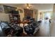 Comfortable living room with a stone fireplace, wood flooring, and dining area with sliding glass doors at 5359 Stafford Nw Dr, Lilburn, GA 30047