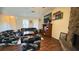Cozy living room with hardwood floors, stone fireplace, and classic decor at 5359 Stafford Nw Dr, Lilburn, GA 30047