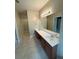 Large bathroom with double vanity, large mirror, and tile floors at 2895 Brandl Cove Ct # 4, Marietta, GA 30067