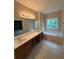 Bathroom with a double vanity, soaking tub under a window, and tile flooring at 2895 Brandl Cove Ct # 4, Marietta, GA 30067