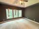 Neutral bedroom featuring a vaulted ceiling with a ceiling fan and large windows at 2895 Brandl Cove Ct # 4, Marietta, GA 30067