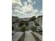 Aerial community view featuring winding streets, trees, landscaping and multiple townhomes at 2895 Brandl Cove Ct # 4, Marietta, GA 30067