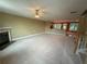 Spacious, carpeted living room with a fireplace and an open floor plan at 2895 Brandl Cove Ct # 4, Marietta, GA 30067