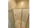 Shower with glass doors and white tile at 2895 Brandl Cove Ct # 4, Marietta, GA 30067