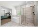 Bathroom boasts large tub, glass shower with niche, and access to the main bedroom at 510 Black Horse Cir, Canton, GA 30114