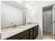 Bathroom with double sinks, granite countertop, dark cabinets and access to shower at 510 Black Horse Cir, Canton, GA 30114