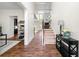 Spacious foyer featuring wood floors, a staircase, and access to multiple rooms at 510 Black Horse Cir, Canton, GA 30114